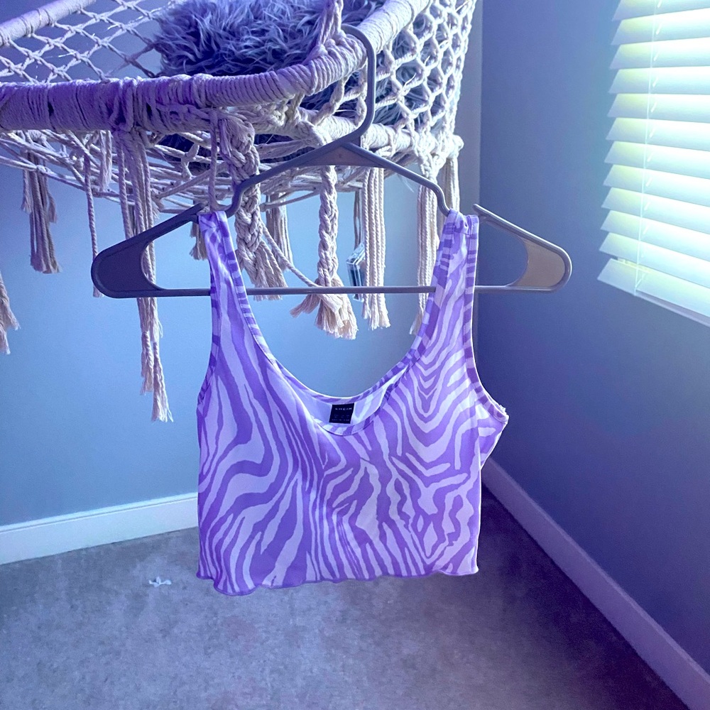 This is a purple zebra striped crop top.